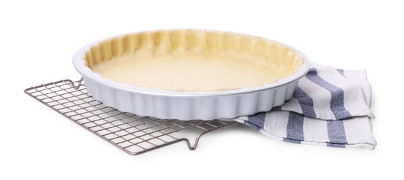 Photo of Making quiche. Tart pan with fresh dough isolated on white