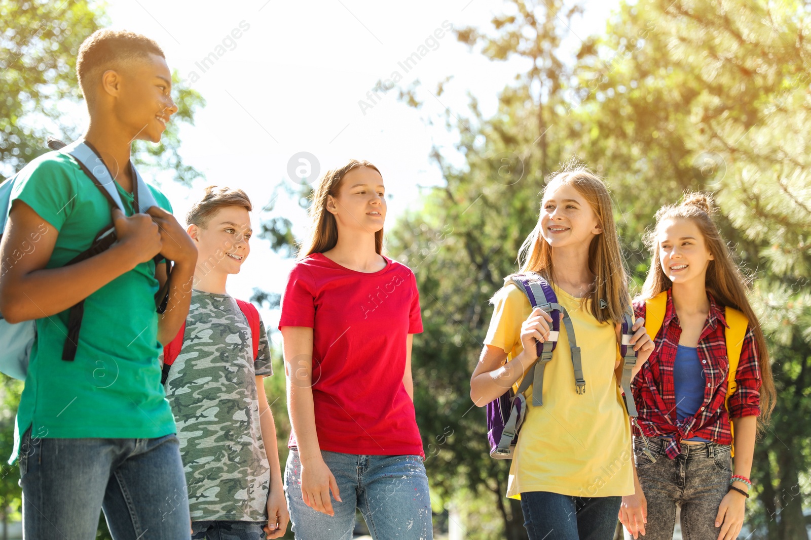Photo of Group of children outdoors on sunny day. Summer camp