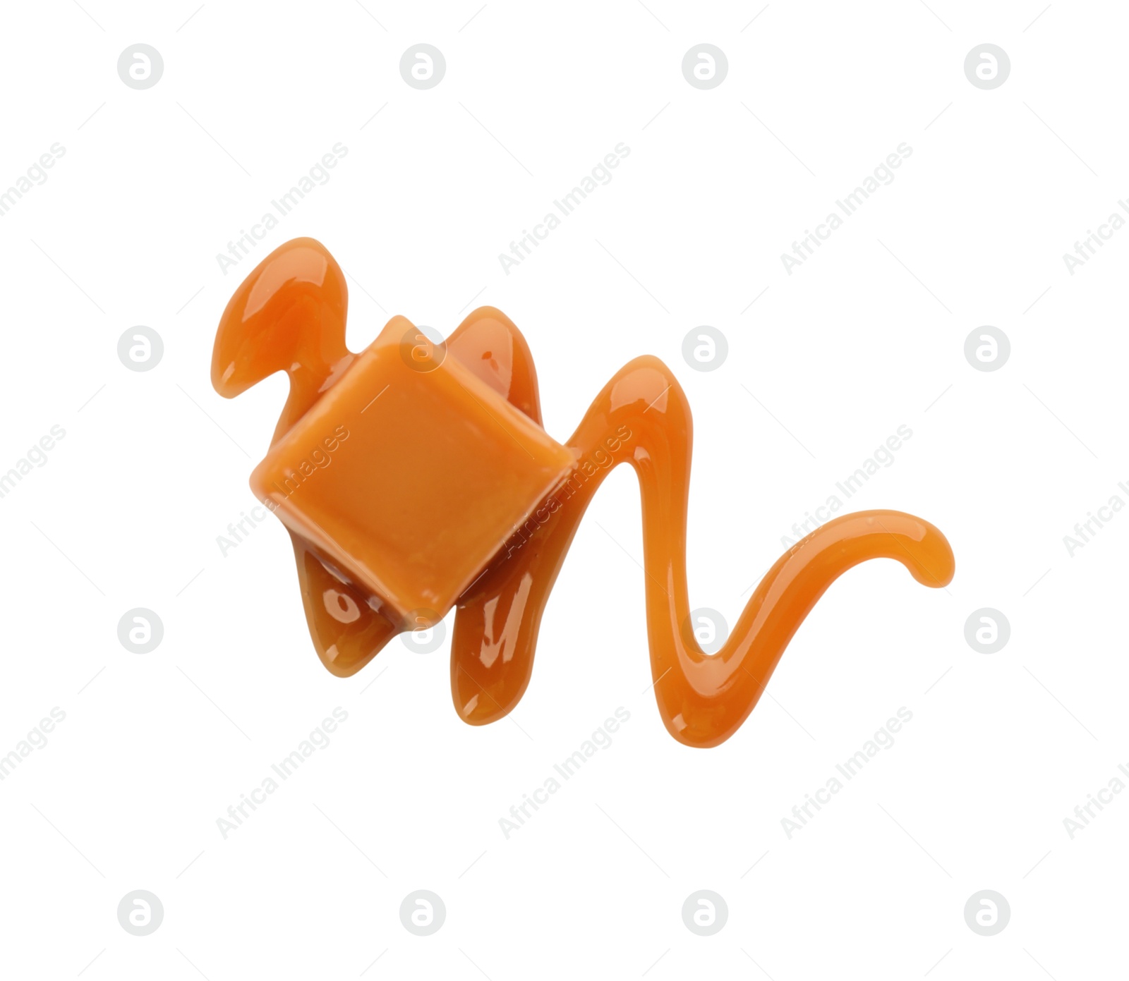 Photo of Sweet caramel candy with topping on white background, top view