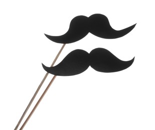 Photo of Fake paper mustaches on sticks against white background