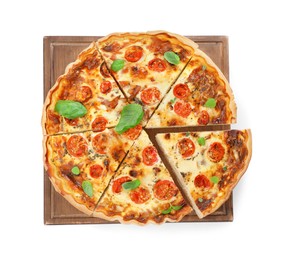 Cut delicious homemade quiche with prosciutto, tomatoes and basil isolated on white, top view