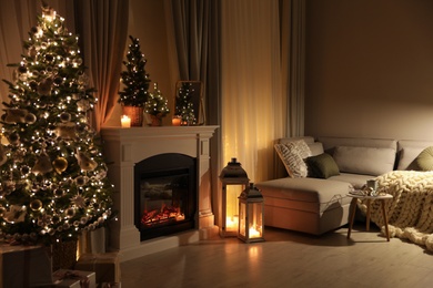 Photo of Stylish living room interior with beautiful fireplace, Christmas tree