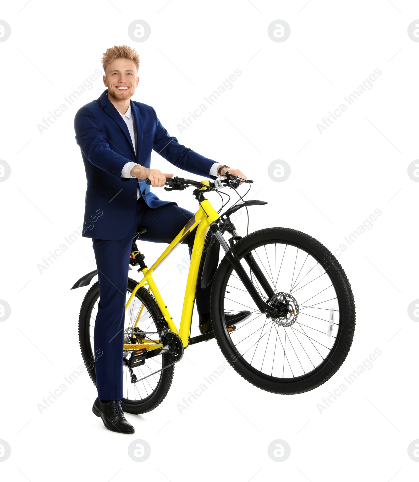 Photo of Young businessman riding bicycle on white background