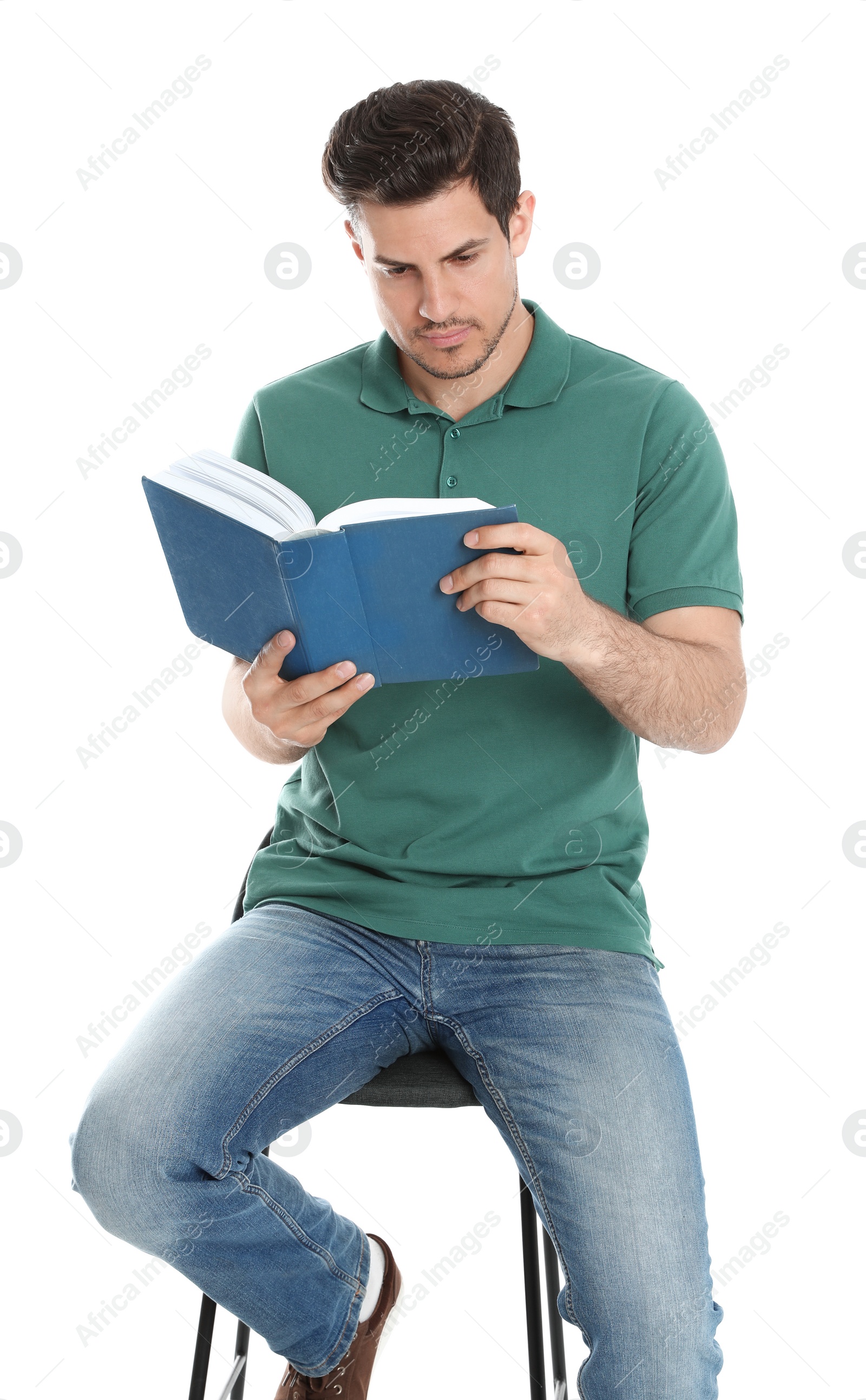 Photo of Handsome man reading book on white background
