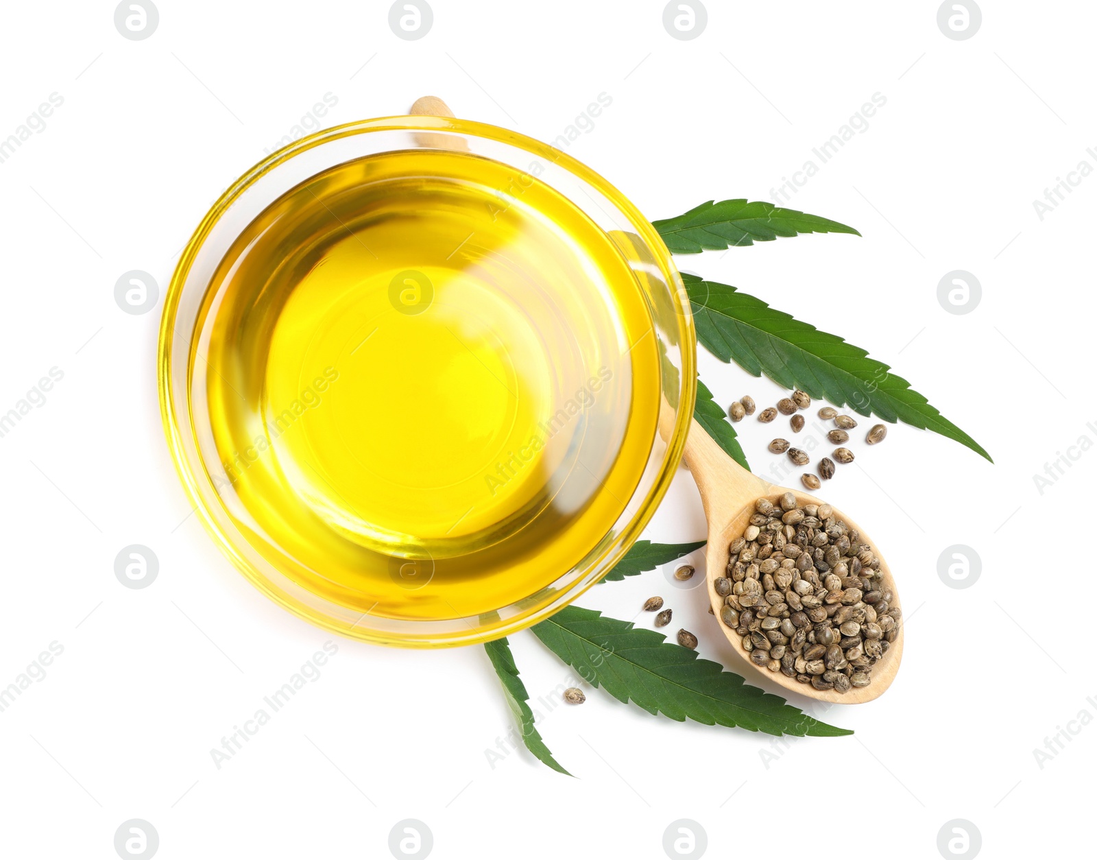 Photo of Hemp oil, fresh leaves and seeds on white background, top view