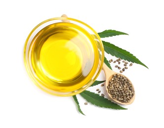 Photo of Hemp oil, fresh leaves and seeds on white background, top view