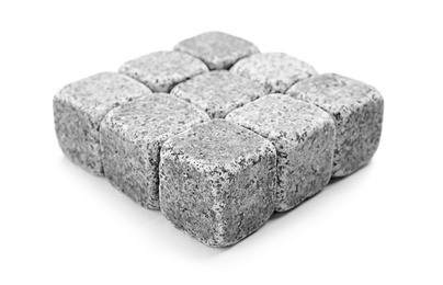 Photo of Classic grey whiskey stones on white background