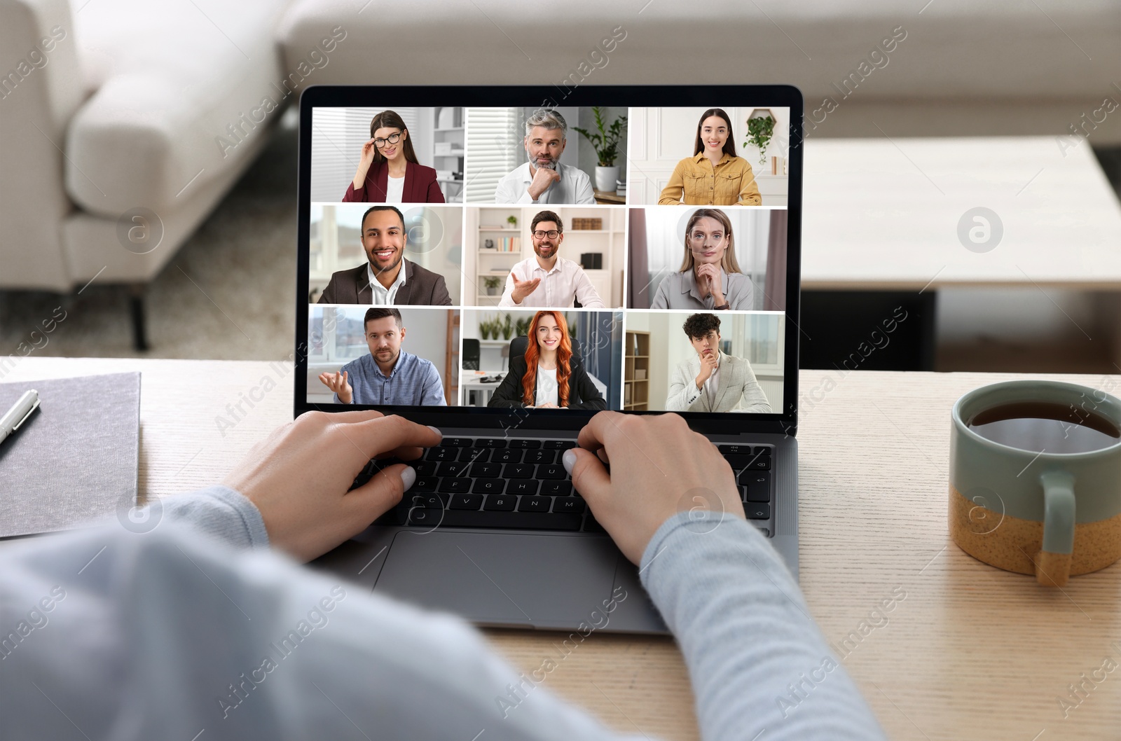 Image of Woman participating in webinar via laptop at table, closeup