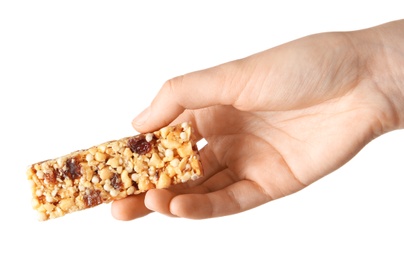 Woman holding grain cereal bar on white background. Healthy snack