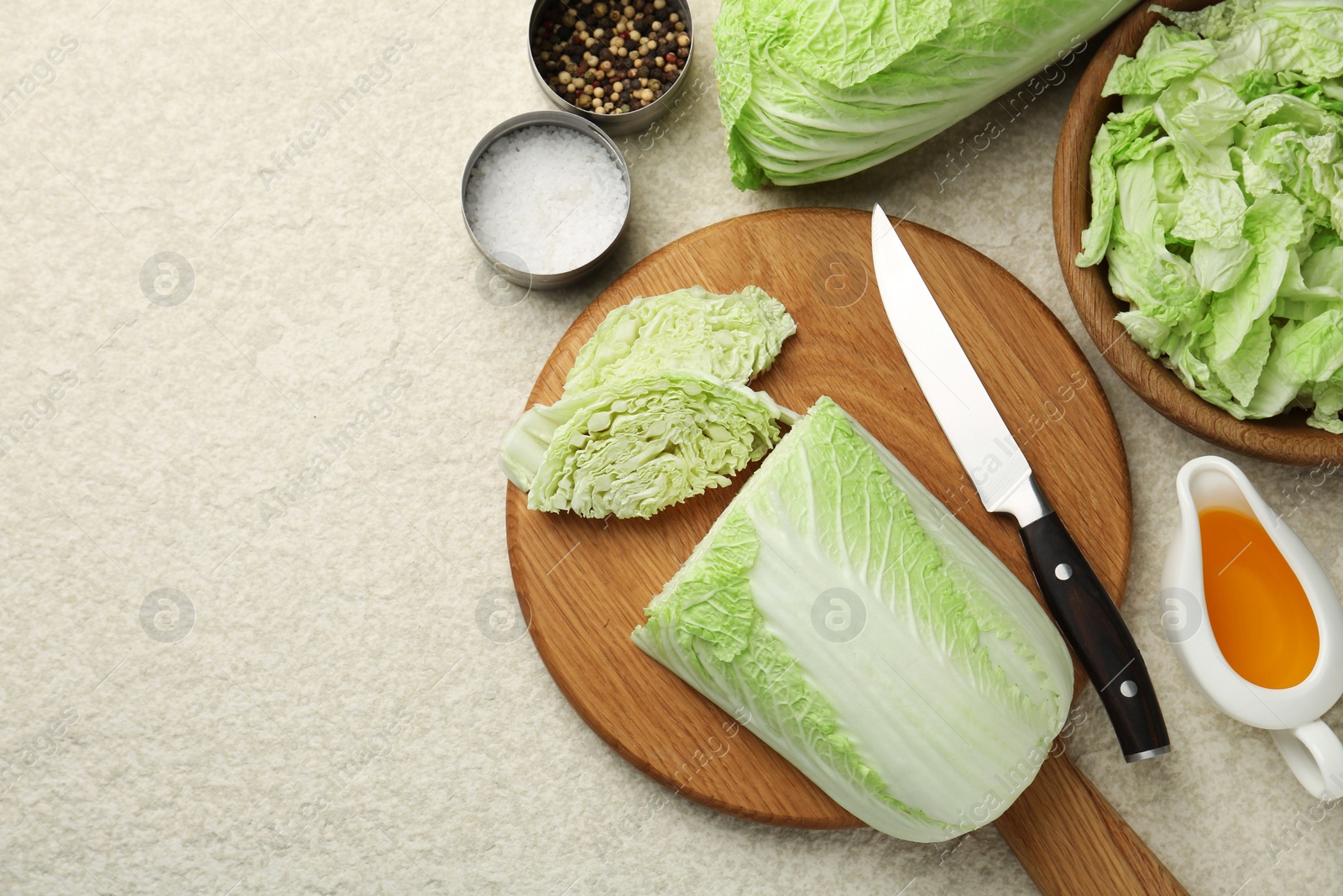 Photo of Fresh Chinese cabbages, oil and spices on light table, flat lay. Space for text