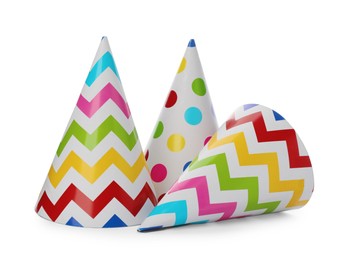 Bright party hats on white background. Festive accessory