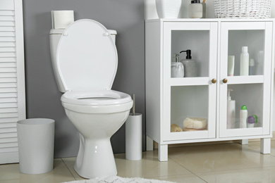 Photo of Stylish toilet bowl in modern bathroom interior