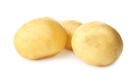 Photo of Fresh raw organic potatoes on white background