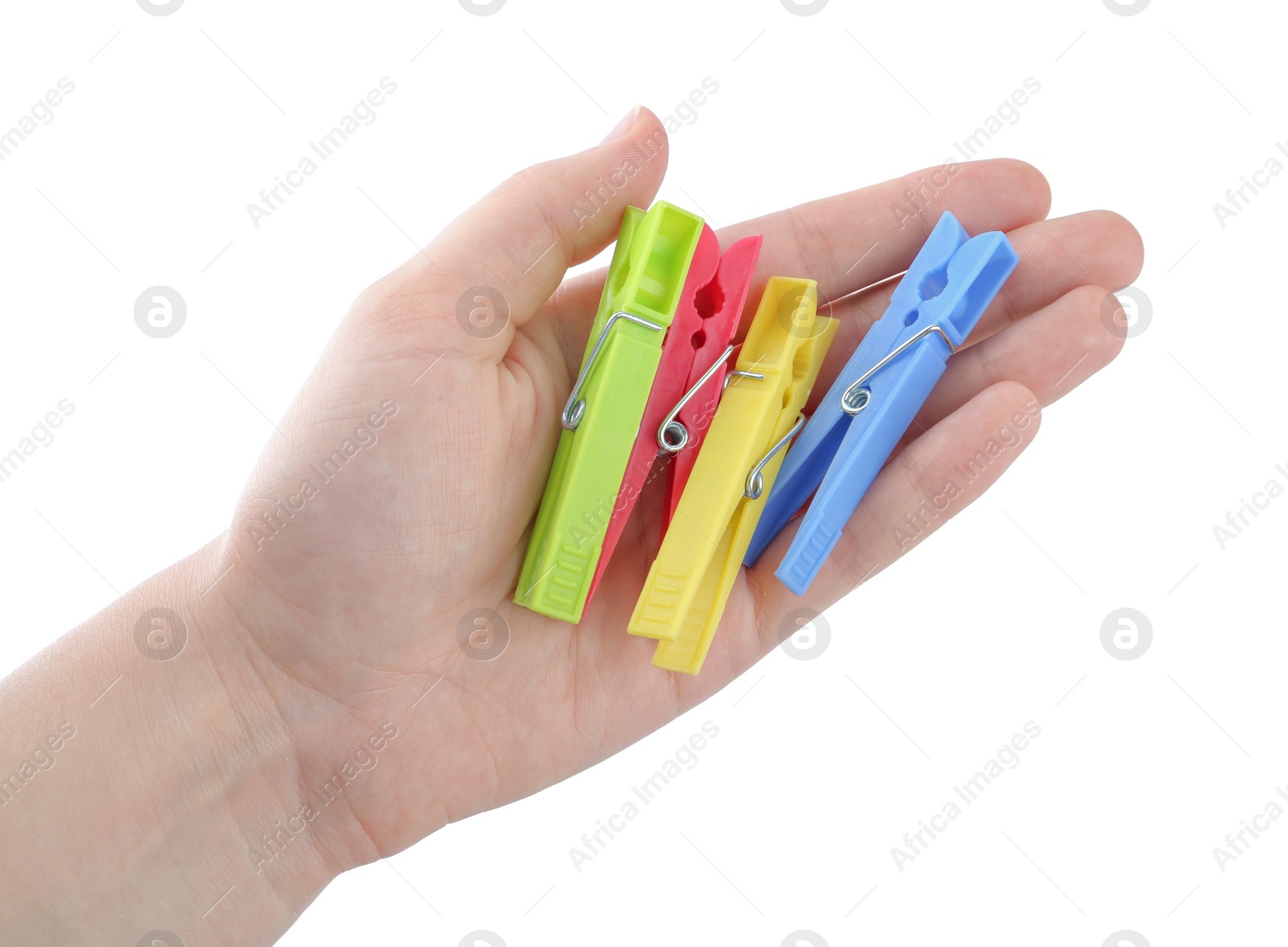 Photo of Woman holding colorful plastic clothespins on white background, closeup