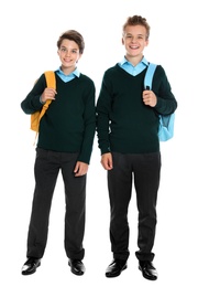 Happy boys in school uniform on white background