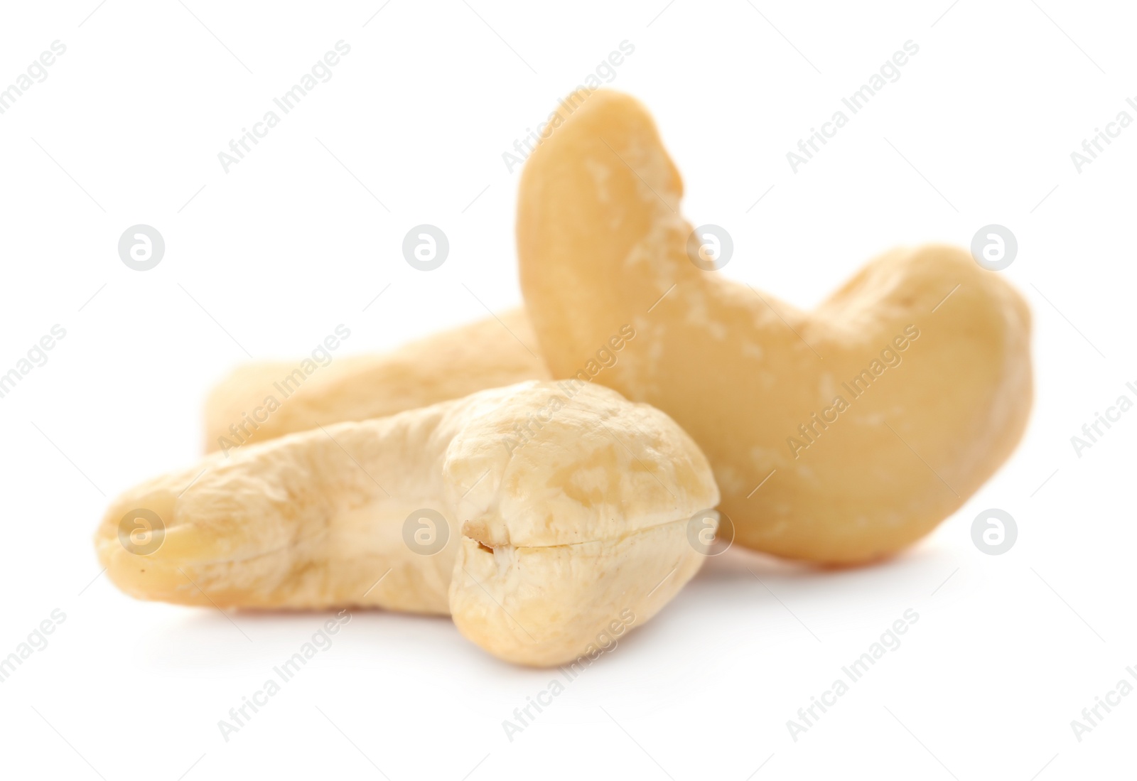 Photo of Pile of tasty organic cashew nuts isolated on white