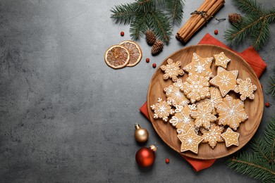 Tasty Christmas cookies and festive decor on grey table, flat lay. Space for text