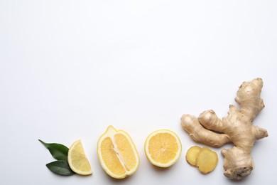 Photo of Fresh lemons and ginger on white background, flat lay. Space for text