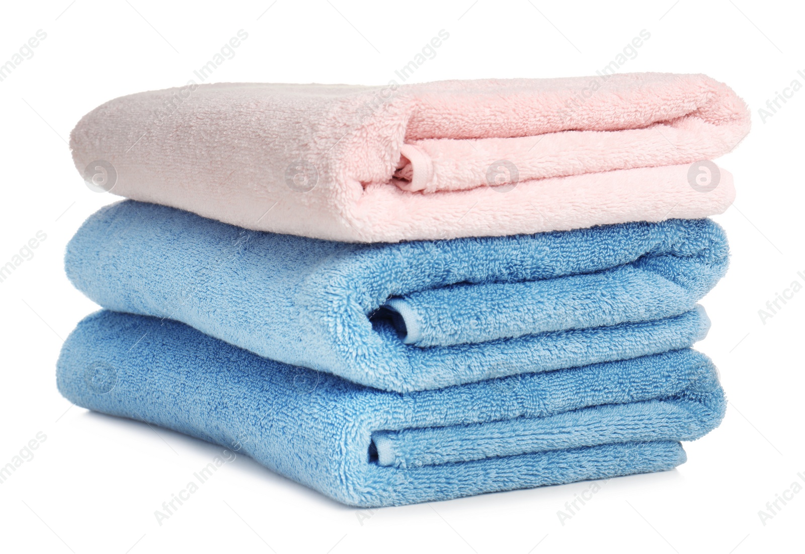 Photo of Folded soft terry towels on white background