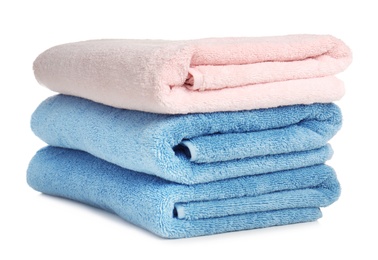 Folded soft terry towels on white background