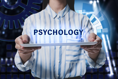 Image of Psychologist holding modern tablet on color background, closeup 