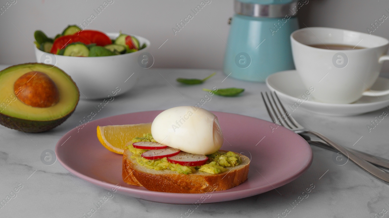 Photo of Tasty sandwich with boiled egg and radish on white marble table