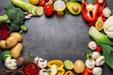 Photo of Flat lay composition with fresh products on grey table, space for text. Healthy cooking