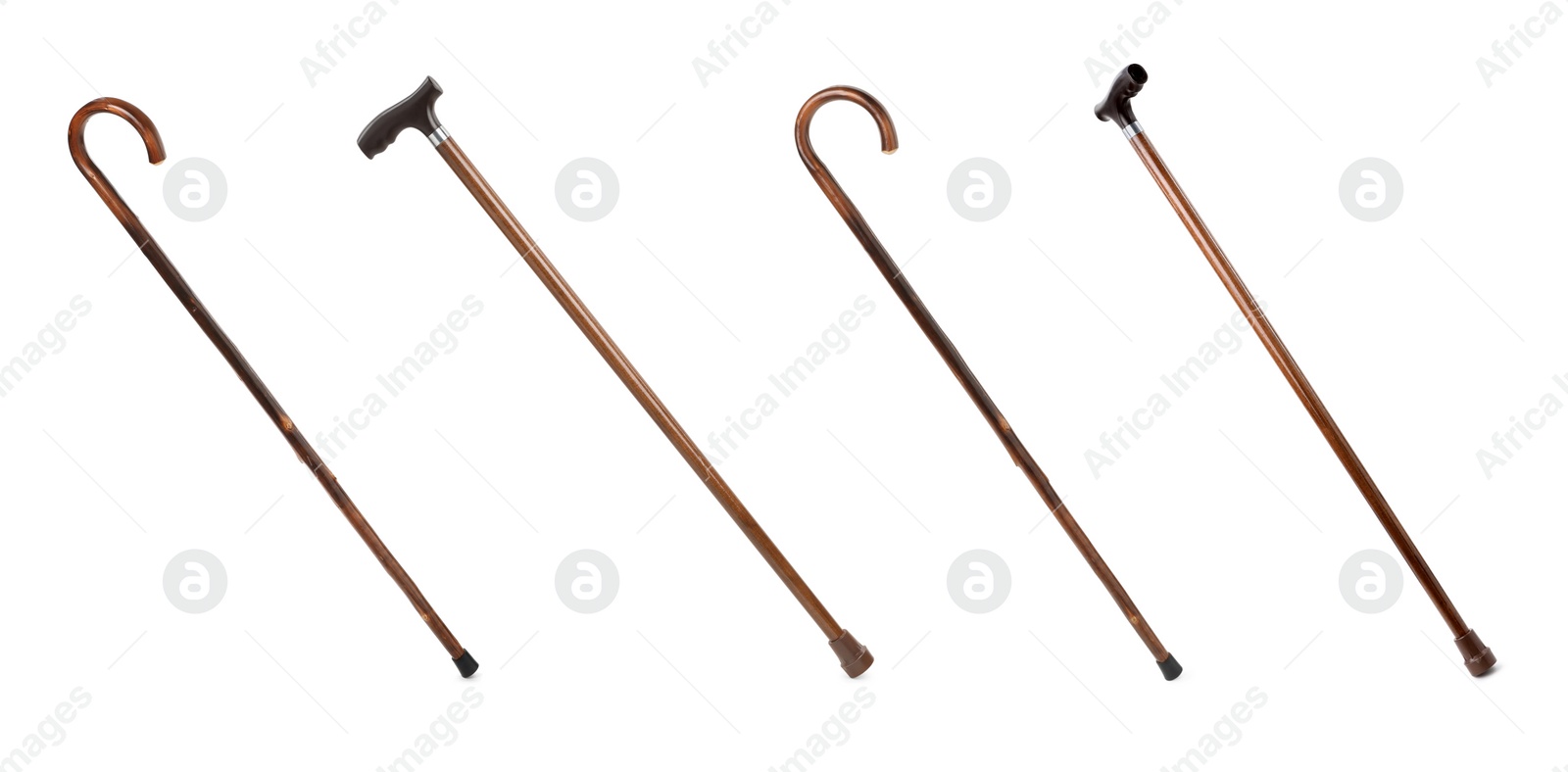 Image of Set with elegant wooden walking canes on white background. Banner design