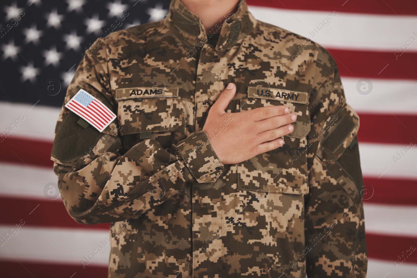 Photo of Male soldier and American flag on background, closeup. Military service