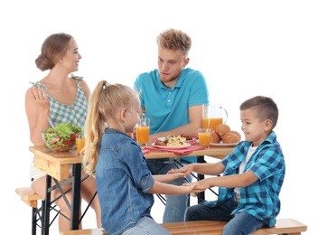 Photo of Happy family having picnic at table on white background