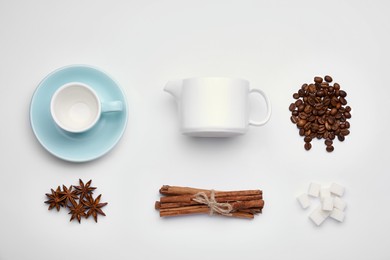 Photo of Flat lay composition with roasted coffee beans and spices on white background