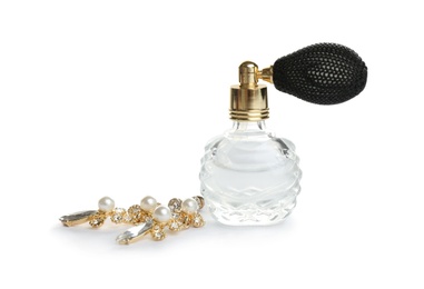 Photo of Glass bottle of perfume and luxury jewellery isolated on white