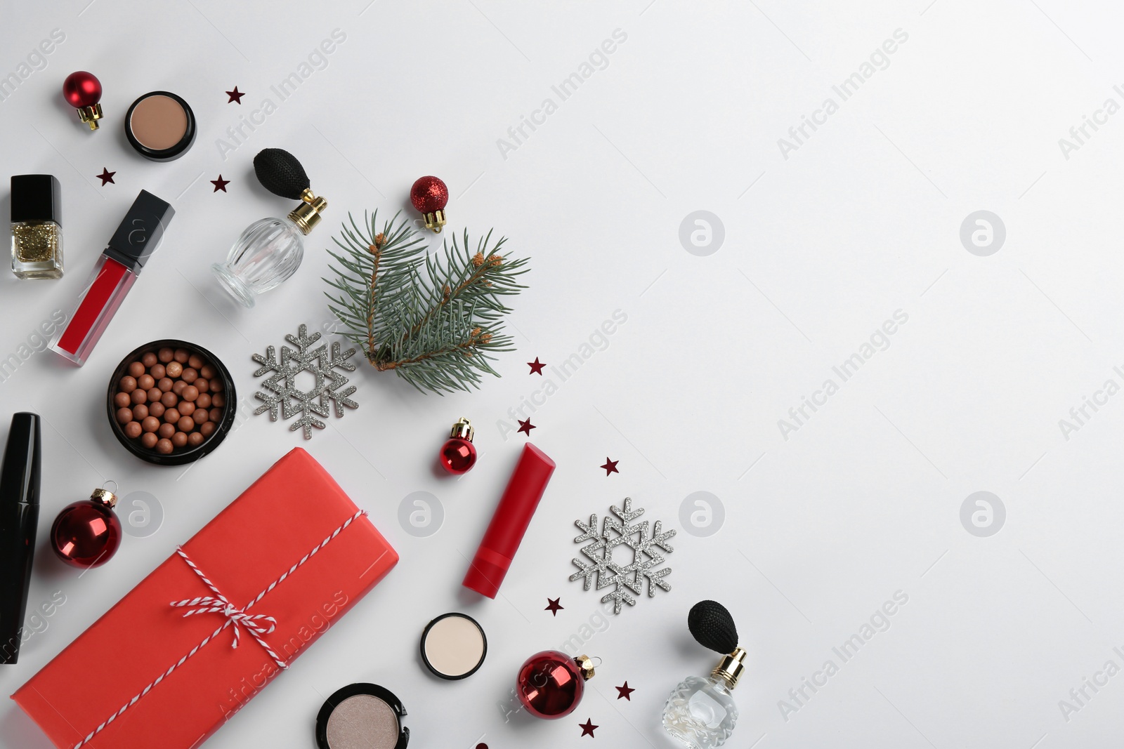 Photo of Flat lay composition with decorative cosmetic products on light background. Winter care. Space for text