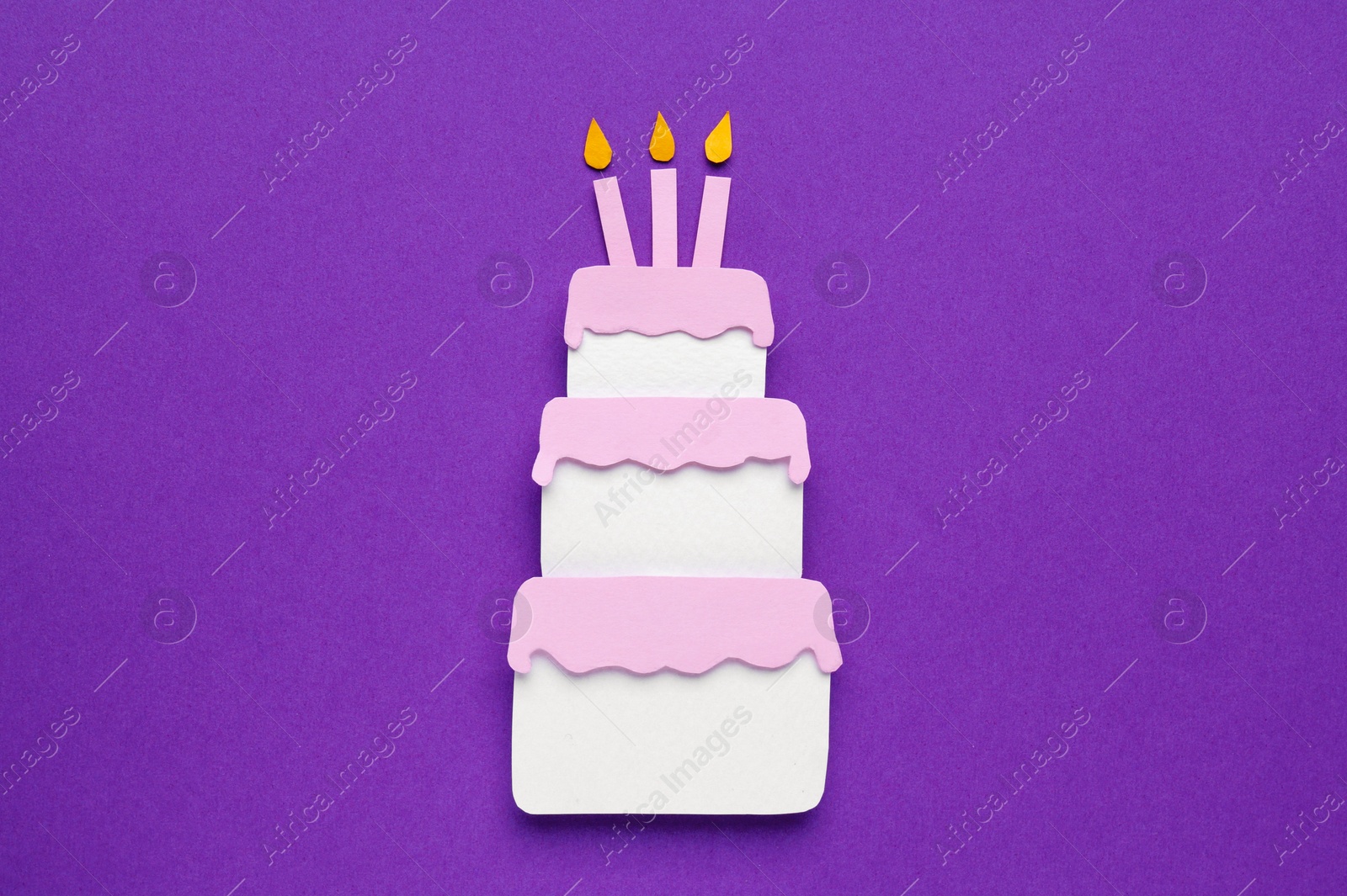 Photo of Birthday party. Paper cake on purple background, top view