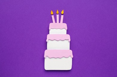 Photo of Birthday party. Paper cake on purple background, top view