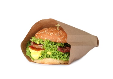 Fresh burger in craft paper on white background