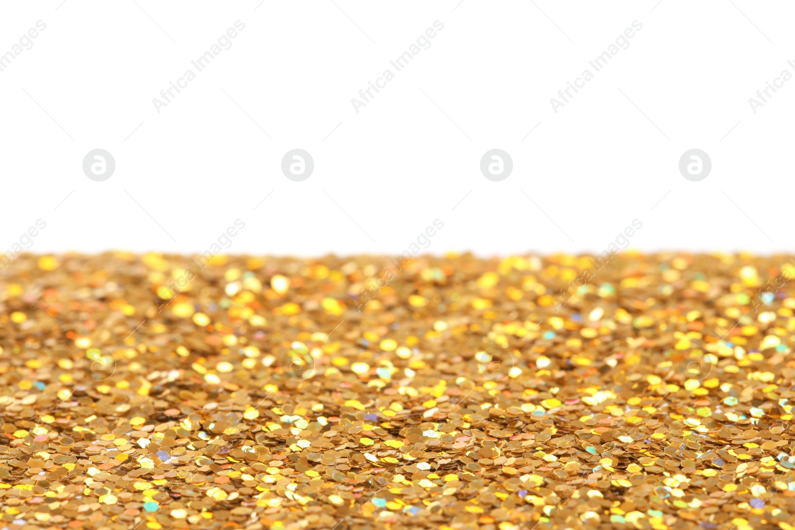 Photo of Many shiny golden paillettes against white background