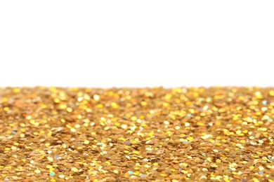 Photo of Many shiny golden paillettes against white background