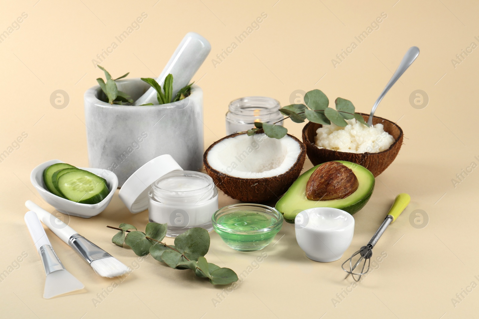 Photo of Homemade cosmetic products, tools and fresh ingredients on beige background. DIY beauty recipe