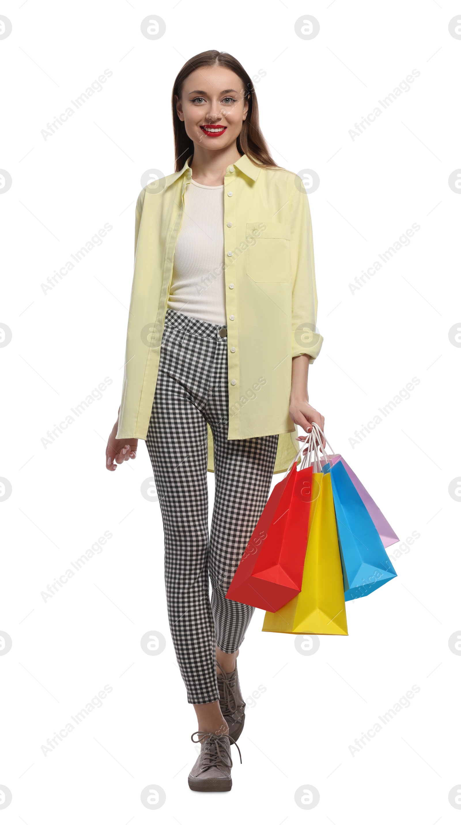 Photo of Stylish young woman with shopping bags on white background