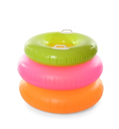 Photo of Different inflatable rings on white background. Summer holidays