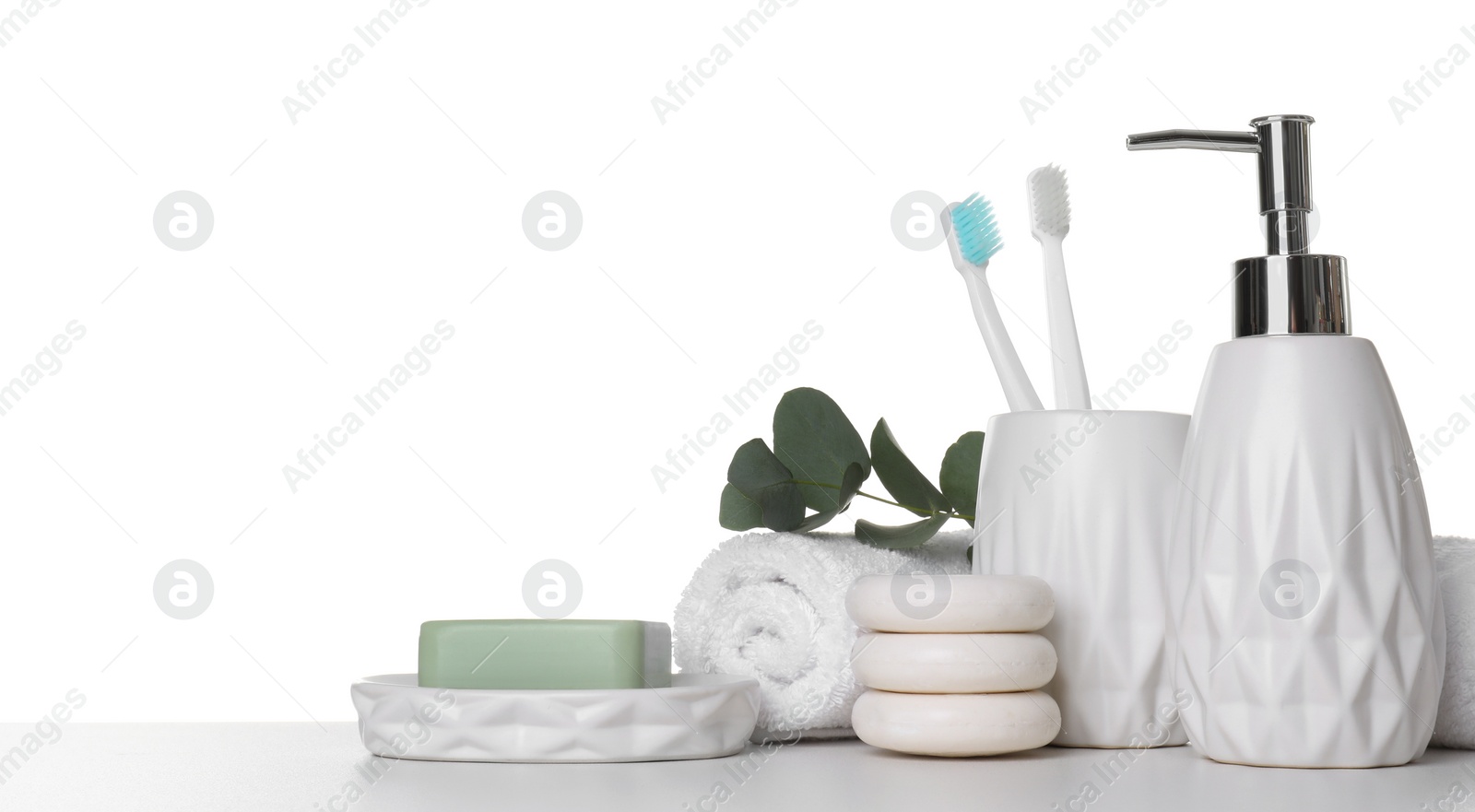 Photo of Bath accessories. Different personal care products and eucalyptus branch on table against white background. Space for text