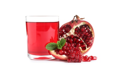 Photo of Glass of pomegranate juice and fresh fruits on white background