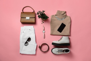 Stylish boots, new clothes, smartphone and accessories on pink background, flat lay