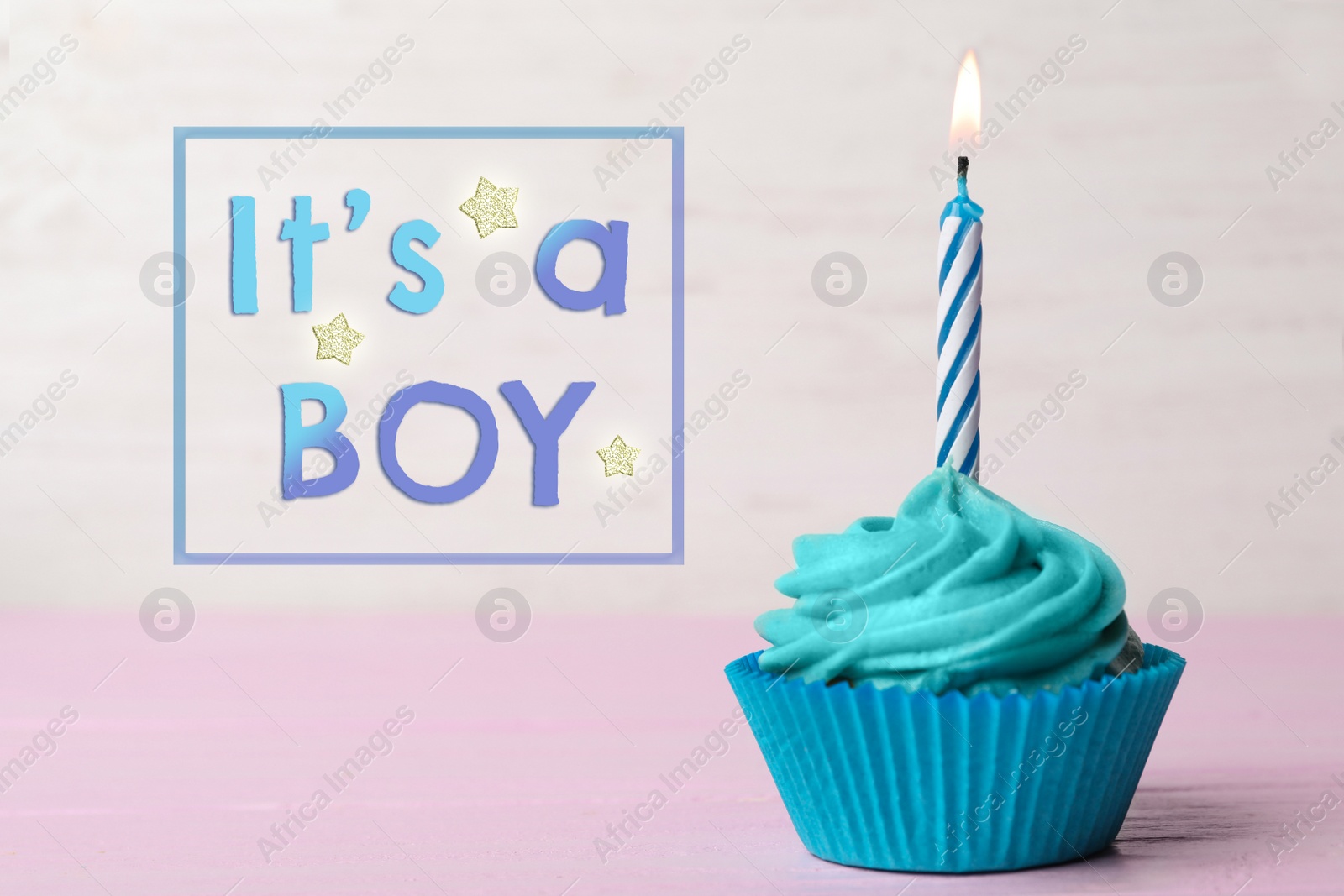 Image of Baby shower cupcake with candle for boy on light background