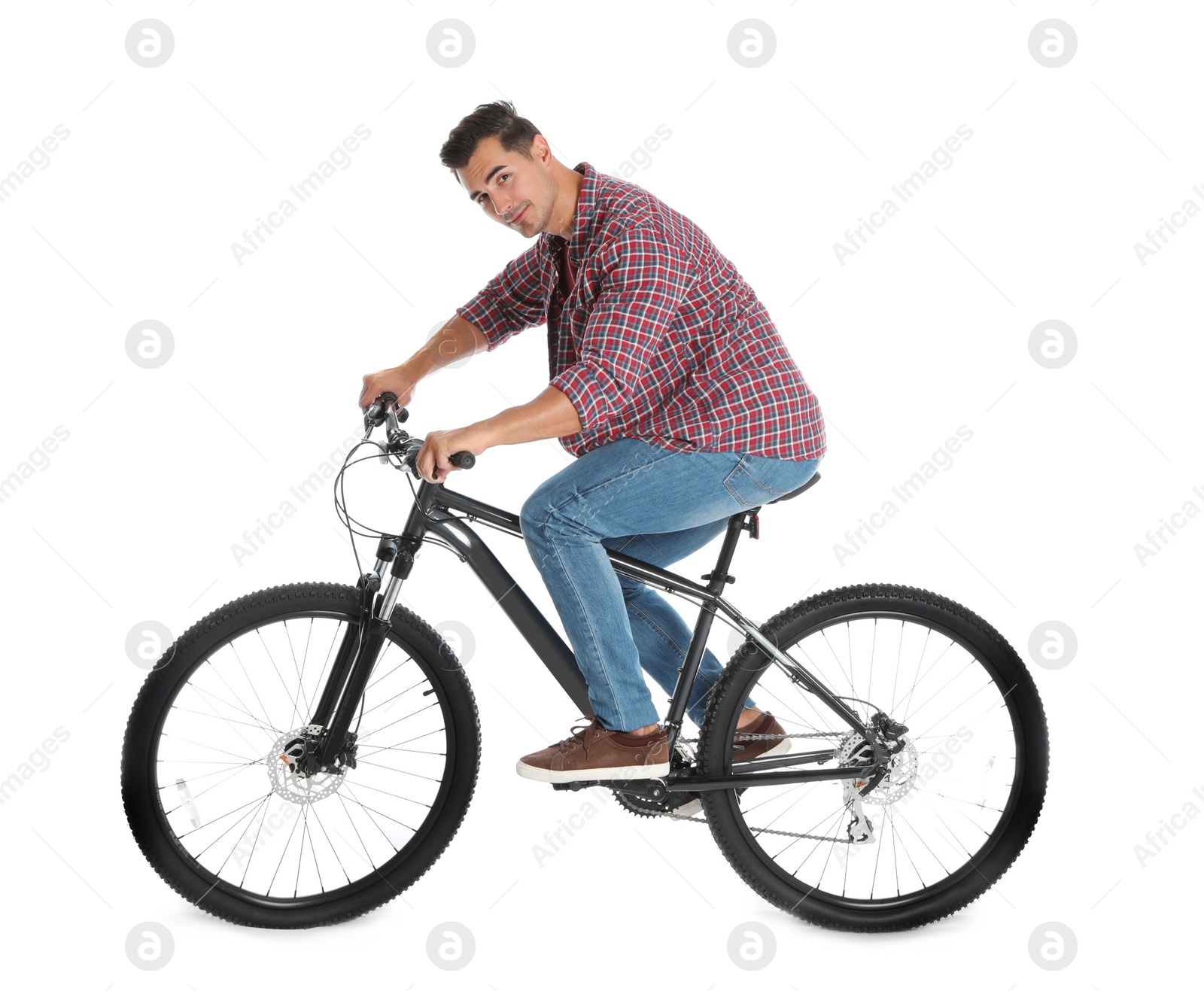 Photo of Handsome young man with modern bicycle on white background