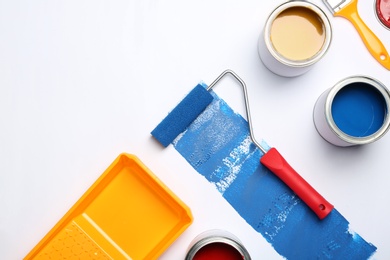 Photo of Composition with paint cans and space for text on white background