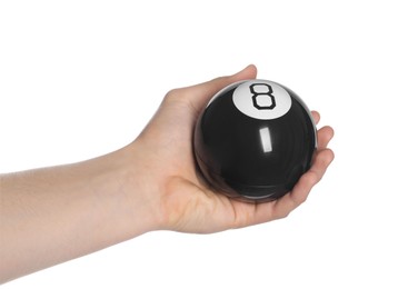 Photo of Man holding magic eight ball on white background, closeup