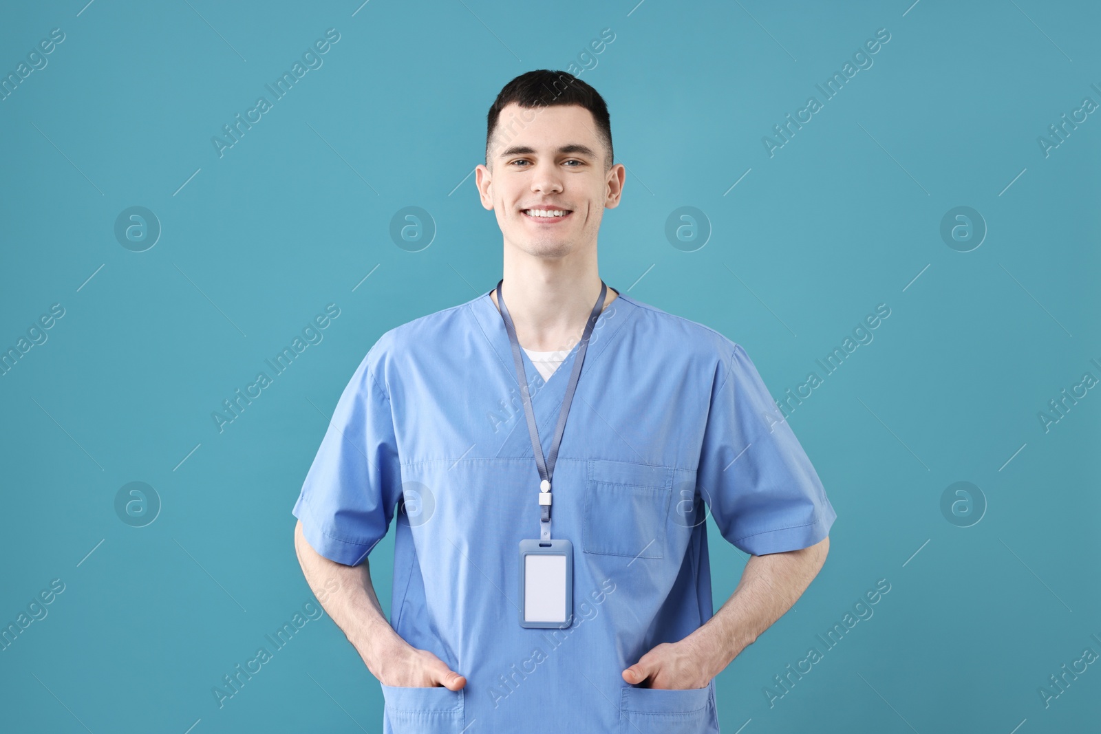 Photo of Portrait of smiling medical assistant on light blue background