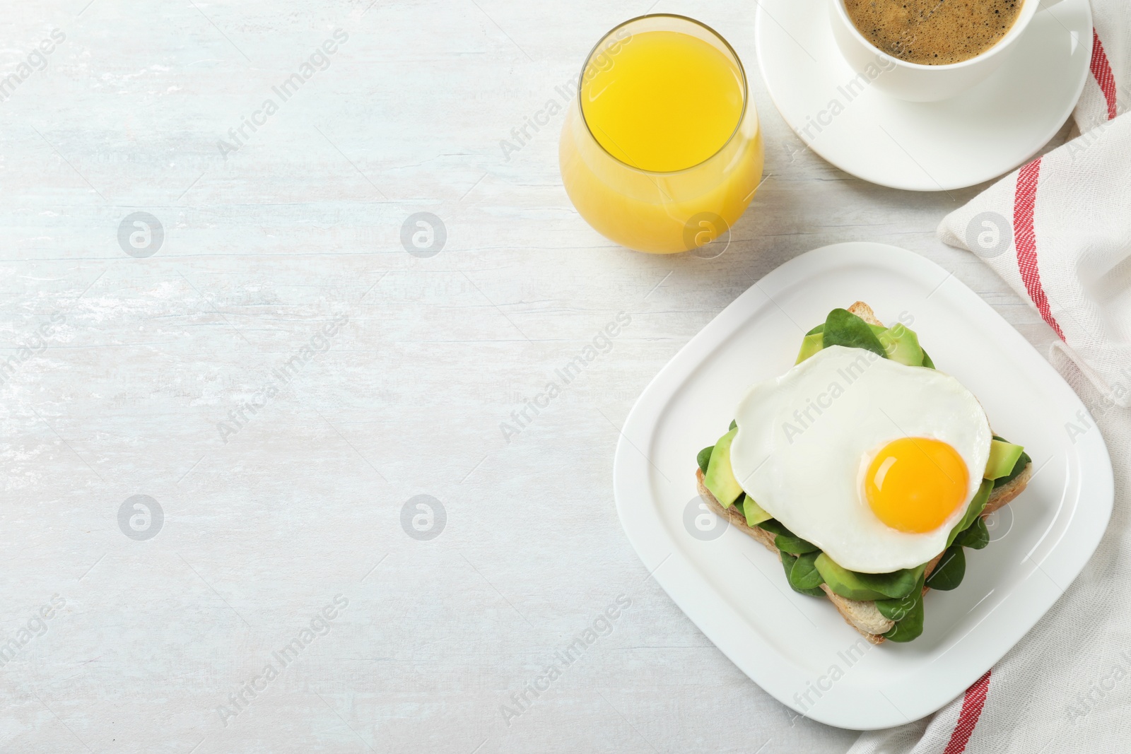 Photo of Delicious breakfast with fried egg served on table, flat lay. Space for text